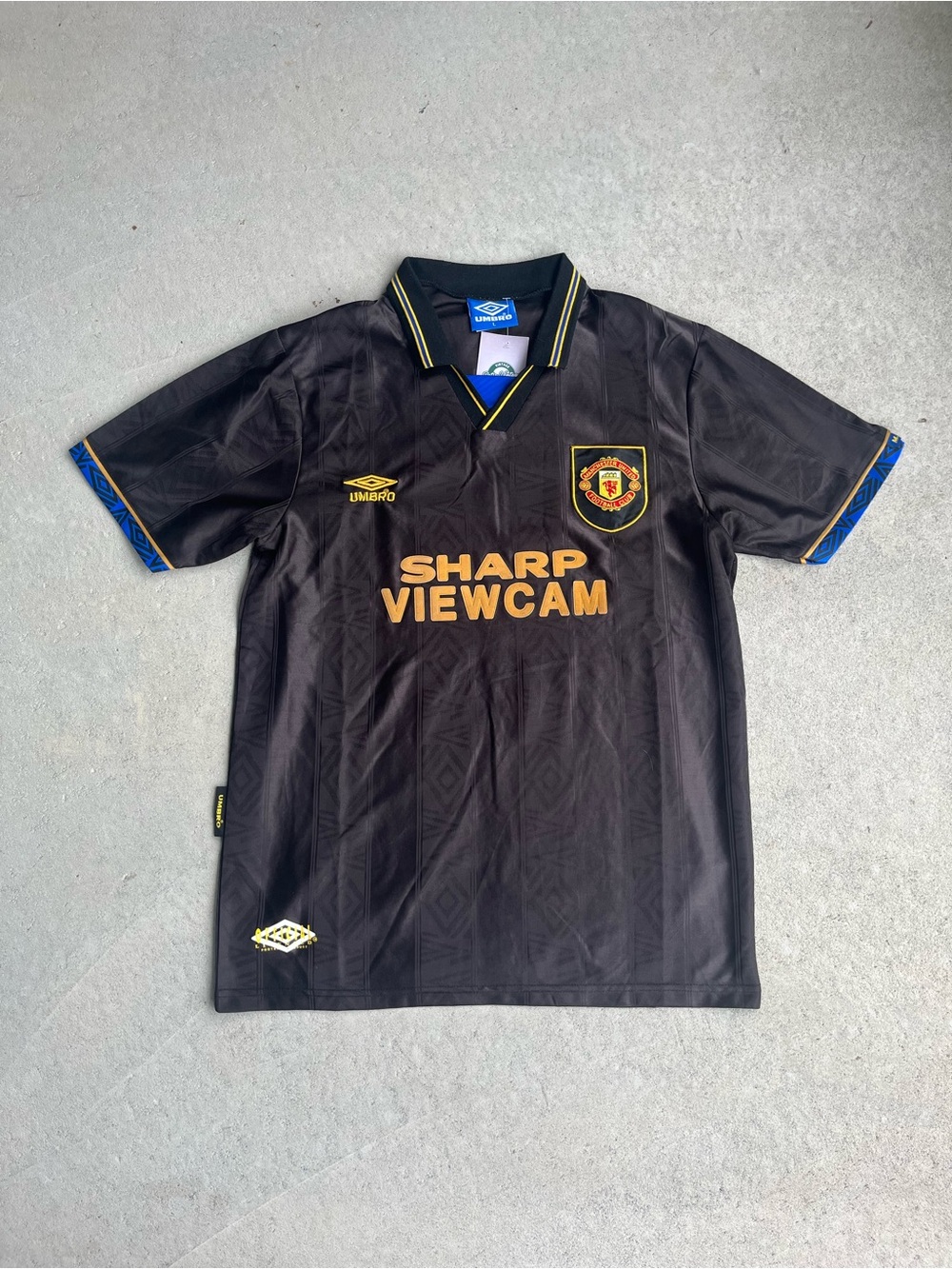Umbro Black Soccer Jersey with Gold Accents